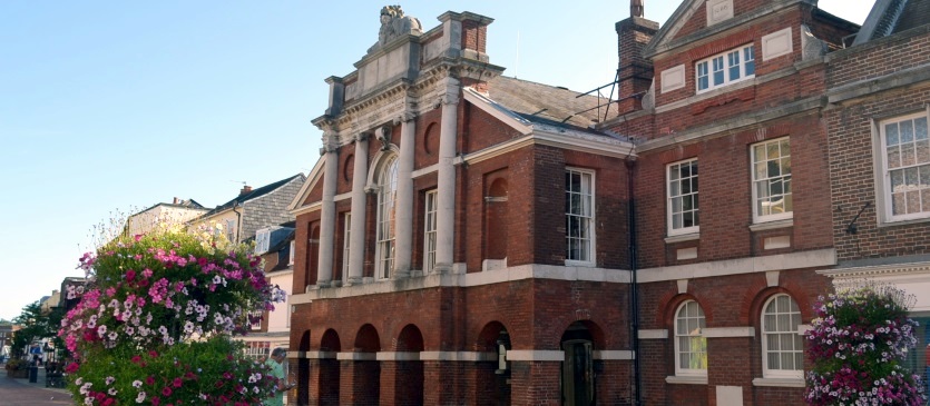 Image showing The Council House, Chichester - Front Facade with Summer Flowers