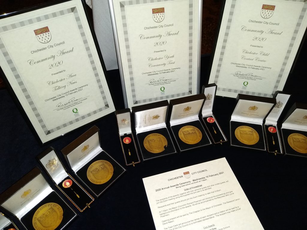 Chichester City Council Civic Awards certificates, medals and pins on display prior to 2020 ceremony