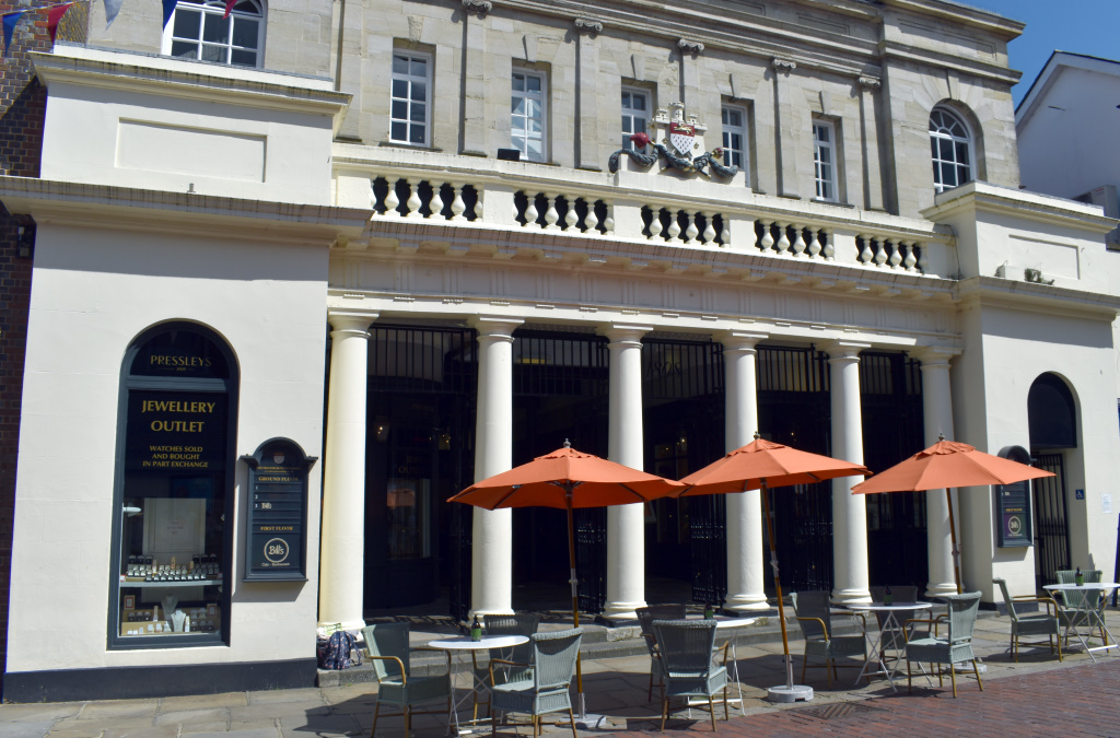 Image showing The Market House, North Street, Chichester with tables in front