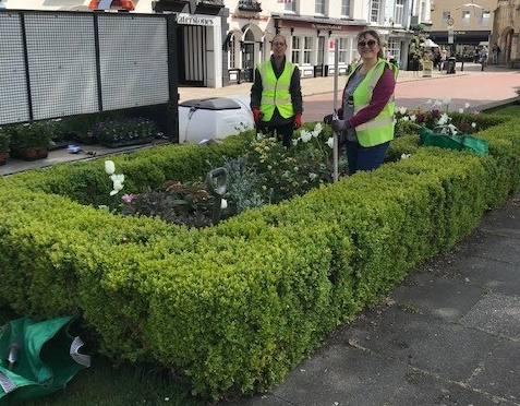 Photo showing City Council officers helping replant Chichester Cathedral flower beds - April 2022