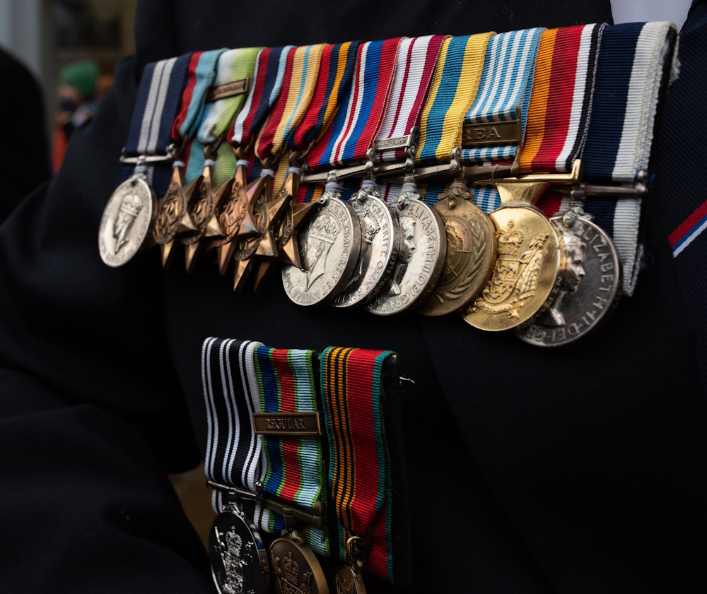 Chichester Remembers 2023 - a veteran proudly displaying service medals