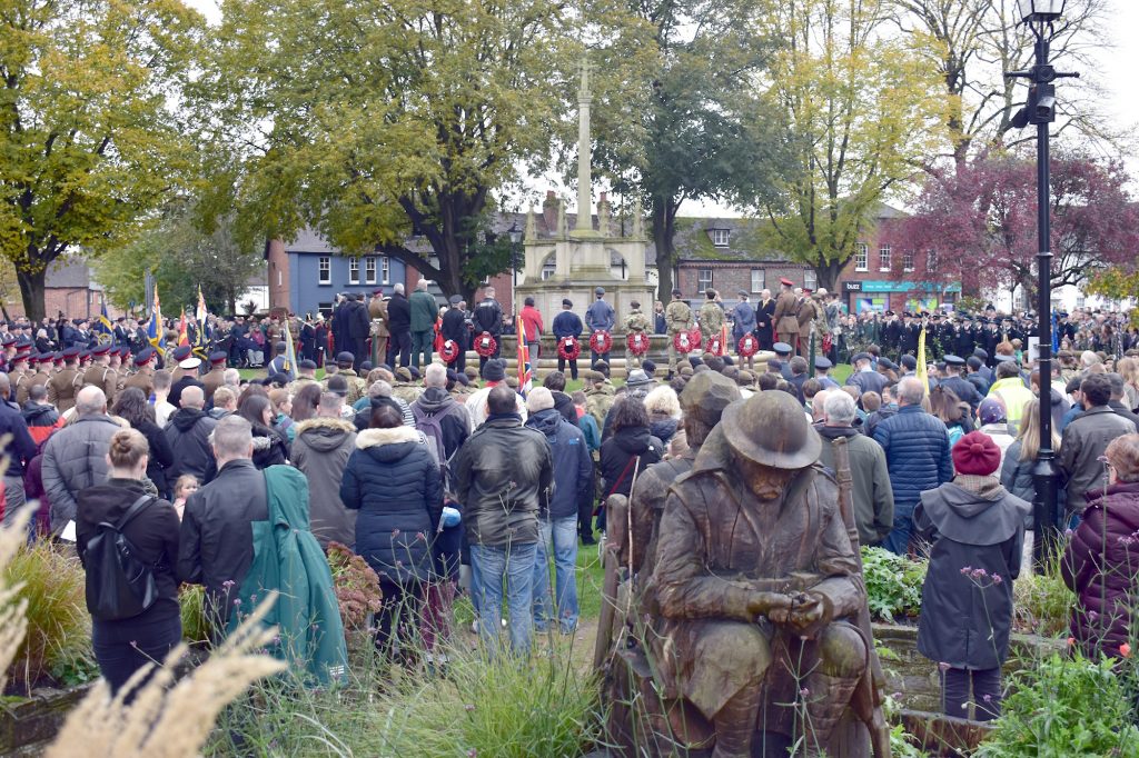 Service attendees awaiting the laying of the wreaths at the War Memorial Litten Gardens - Remembrance 12-11-2023