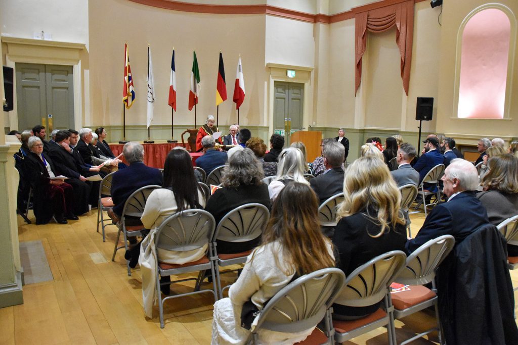 Photograph of the Assembly Room while the Mayor is speaking with guests in attendance.